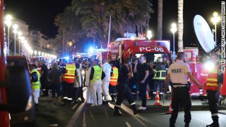 Police officers, firefighters and rescue workers are seen at the site of an attack on July 15, 2016, after a truck drove into a crowd watching a fireworks display in the French Riviera town of Nice.
A truck ploughed into a crowd in the French resort of Nice on July 14, leaving at least 60 dead and scores injured in an &quot;attack&quot; after a Bastille Day fireworks display, prosecutors said on July 15.  / AFP / Valery HACHE        (Photo credit should read VALERY HACHE/AFP/Getty Images)