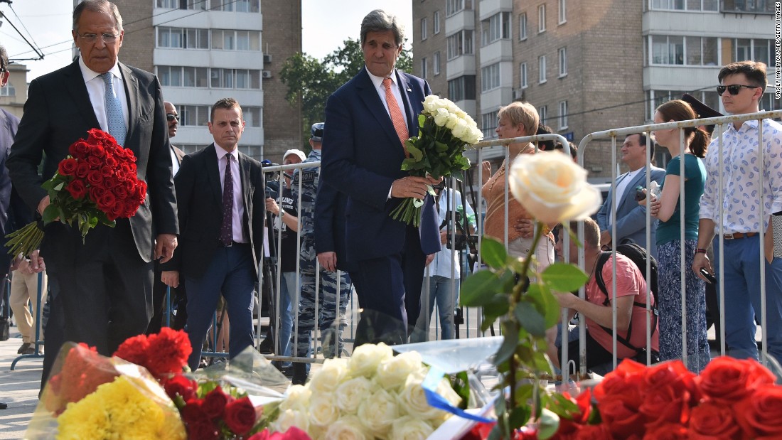 Russian Foreign Minister Sergei Lavrov and U.S. Secretary of State John Kerry lay flowers outside the French Embassy in Moscow.