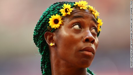 Flower power:  Fraser-Pryce ahead of winning 100m gold at the 2015 world championships.
