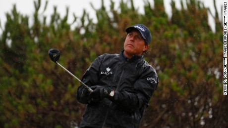Mickelson caught the worst of the morning rain after a dry, still start.