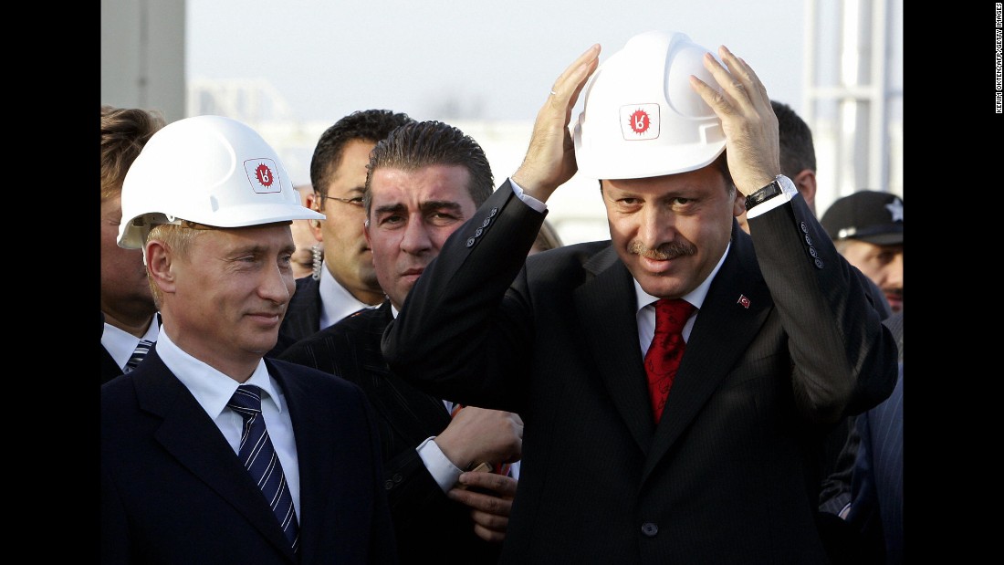 Russian President Vladimir Putin, left, and Erdogan wear helmets in Durusu village near Turkey&#39;s northern city of Samsun, on November 17, 2005, during the inauguration ceremony for the major trans-Black Sea gas pipeline Blue Stream. The pipeline runs from Russia to Turkey.