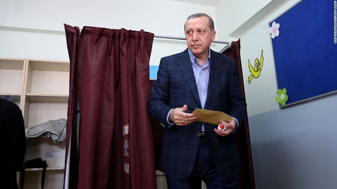 Erdogan leaves a polling booth after casting his vote in Turkey&#39;s 26th general election at a polling station in Istanbul on November 1, 2015.