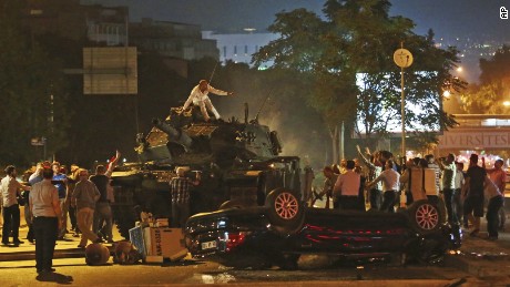 Tanks move into position as Turkish people attempt to stop them, in Ankara, Turkey, early Saturday, July 16, 2016. Turkey&#39;s armed forces said it &quot;fully seized control&quot; of the country Friday and its president responded by calling on Turks to take to the streets in a show of support for the government. A loud explosion was heard in the capital, Ankara, fighter jets buzzed overhead, gunfire erupted outside military headquarters and vehicles blocked two major bridges in Istanbul.