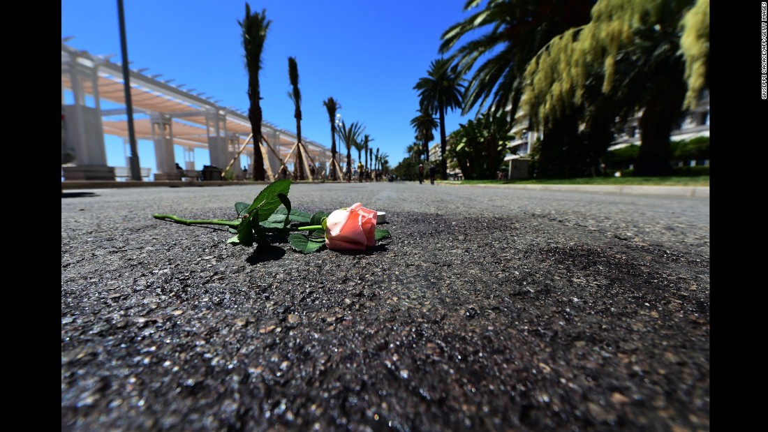 A flower was laid on a blood mark of one of the victims of the deadly Bastille Day attack in the Promenade des Anglais in Nice.