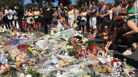 Numerous flowers, candles and other tributes lie in Nice, France, on Saturday in memory of those killed in Thursday&#39;s terror attack in the coastal city.