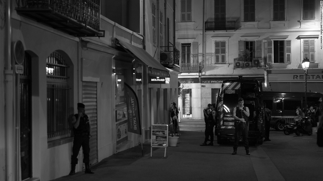 Policemen patrol the streets.