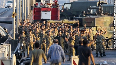 ISTANBUL, TURKEY - JULY 16: Soldiers involved in the coup attempt surrender on Bosphorus bridge with their hands raised on July 16, 2016  in Istanbul, Turkey. Istanbul&#39;s bridges across the Bosphorus, the strait separating the European and Asian sides of the city, have been closed to traffic. Turkish President Recep Tayyip Erdogan has denounced an army coup attempt, that has left atleast 90 dead 1154 injured in overnight clashes in Istanbul and Ankara. (Photo by Gokhan Tan/Getty Images)