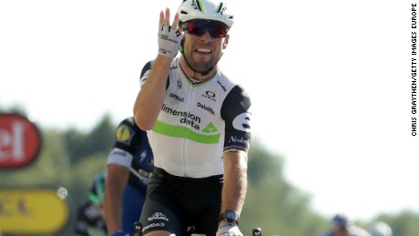 Mark Cavendish holds up four fingers after taking the 14th stage of the Tour de France for Team Dimension Data -- his fourth in this year&#39;s race.