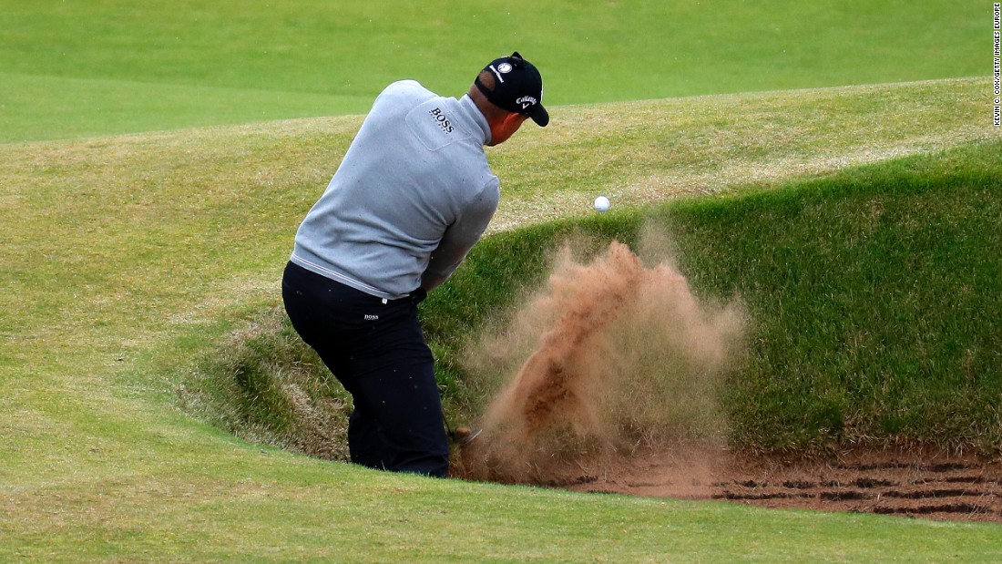 Stenson has to play out of one of the many steep bunkers at Troon on the 7th hole during his third round 68. 