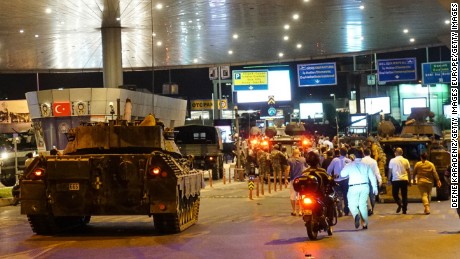 Military vehicles enter Istanbul Ataturk Airport following an attempted coup attempt in Turkey. 