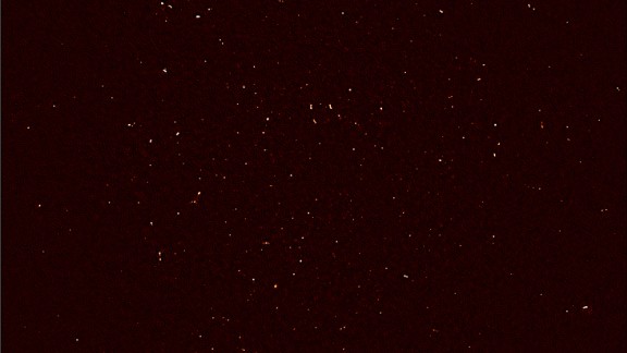MeerKAT's First Light image. Each white dot represents the intensity of radio waves recorded with 16 dishes of the MeerKAT telescope in the Karoo desert. 

More than 1,300 individual objects - galaxies in the distant universe - are seen in this image.