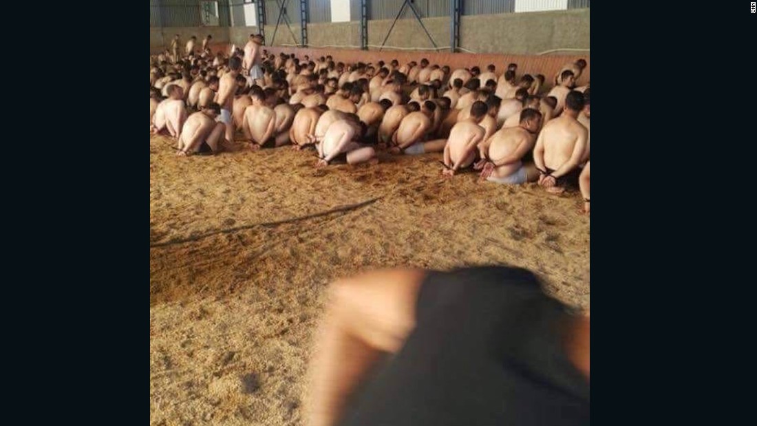In a mass detention in Ankara, dozens of detainees are forced to kneel, partially stripped.