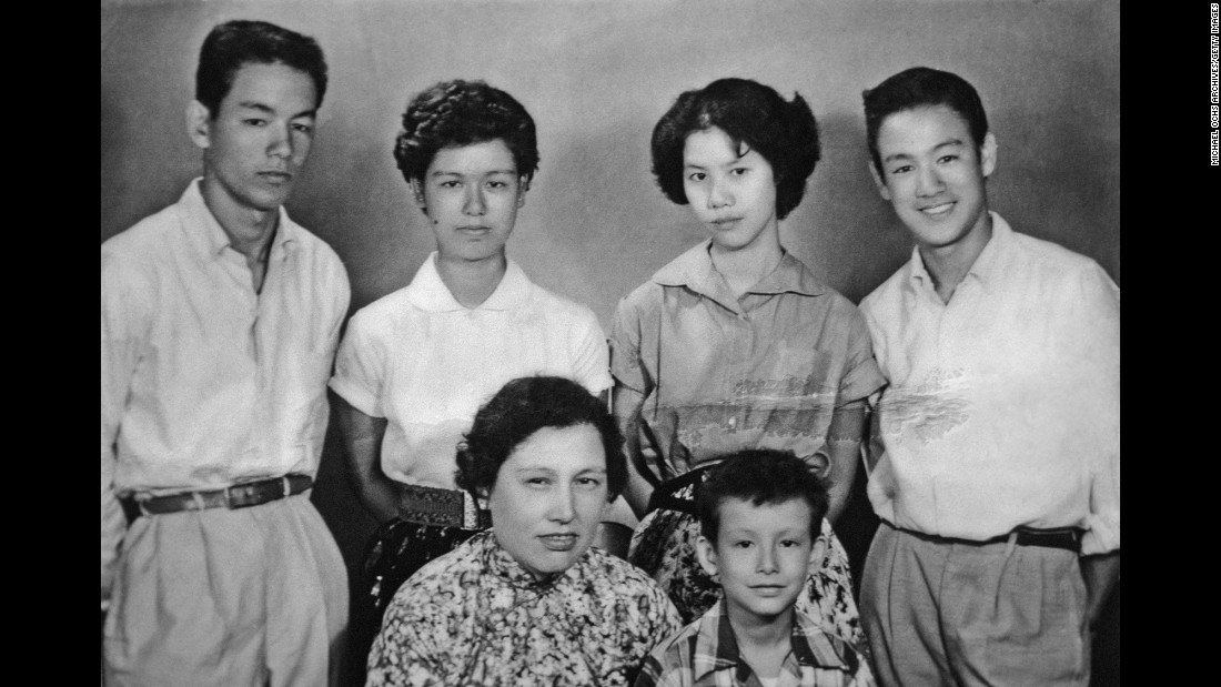 Bruce Lee, right,                                                                                                                                                                                                                                                                                                                                                                                                                                                                                                                                                                                                                                                                                                                                                                                                                                                                                                                                                                                        along with his mother and siblings poses for a family snapshot circa the late 1950s in Kowloon, Hong Kong. Lee grew up in an affluent family. His father was a famous opera star.