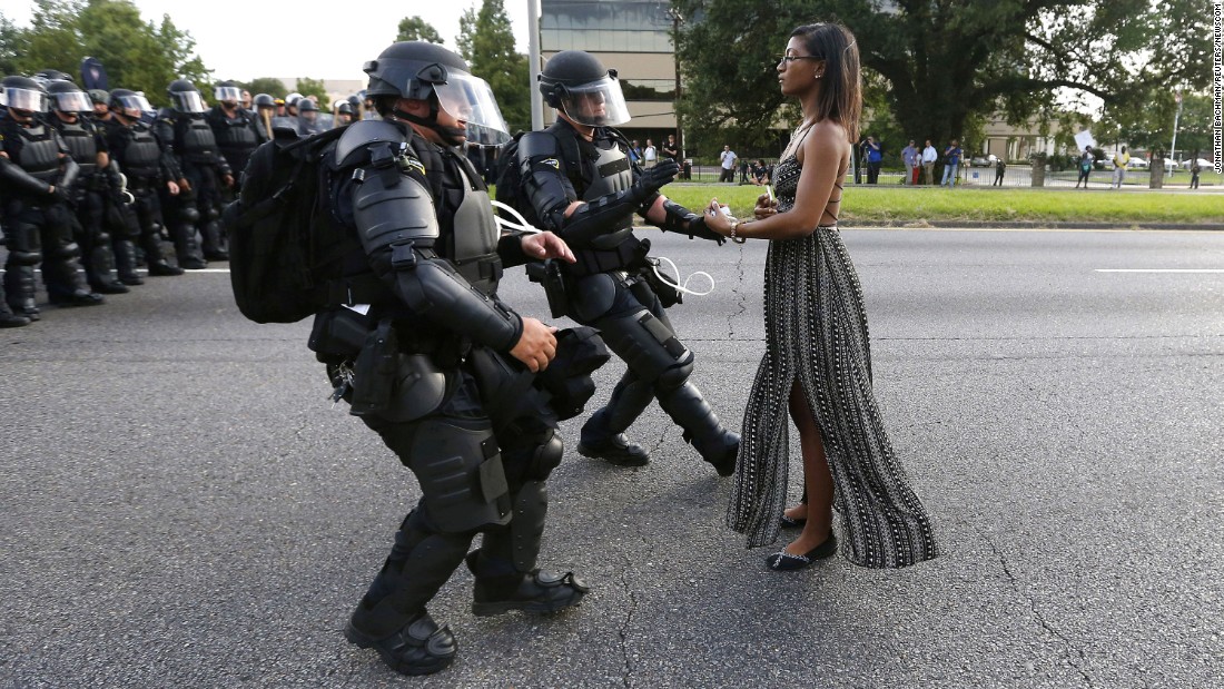 Protester Ieshia Evans is detained by law enforcement officers near the police headquarters in Baton Rouge, Louisiana, on Saturday, July 9. Evans was among dozens of people protesting &lt;a href=&quot;http://www.cnn.com/2016/07/07/us/baton-rouge-alton-sterling-shooting/&quot; target=&quot;_blank&quot;&gt;the death of Alton Sterling,&lt;/a&gt; who was fatally shot by police just a few days earlier. Click through the gallery to see memorable images from other protests throughout history.