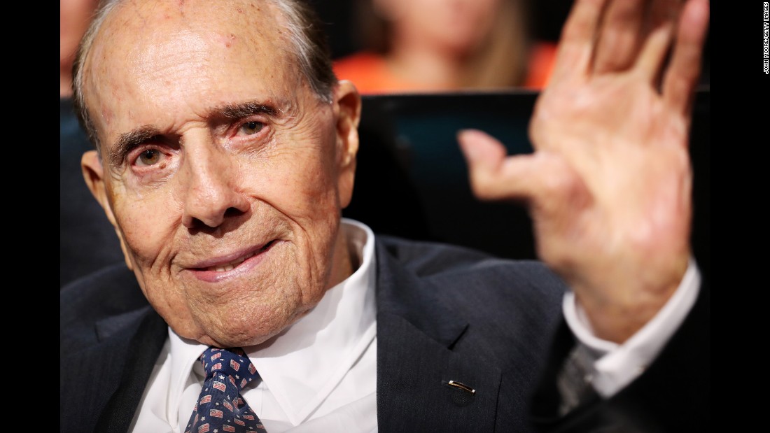 Former U.S. Sen. Bob Dole, the GOP&#39;s presidential nominee in 1996, waves after listening to a speech on Monday.