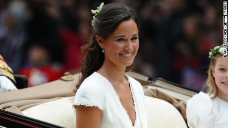 Maid of honour Philippa Middleton smiles as the travels in a Semi-State Landau in London after the wedding service for Britain&#39;s Prince William and Kate, Duchess of Cambridge, on April 29, 2011.   AFP PHOTO / PAUL ELLIS (Photo credit should read PAUL ELLIS/AFP/Getty Images)