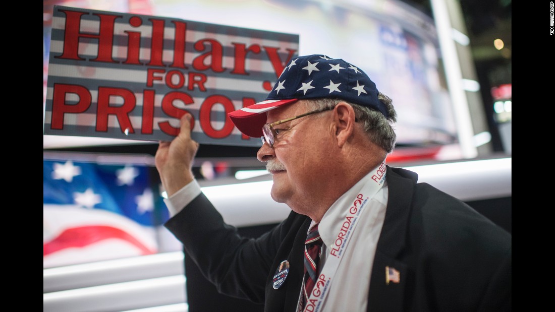 A Florida delegate holds a &quot;Hillary for prison&quot; sign on the floor of the arena.