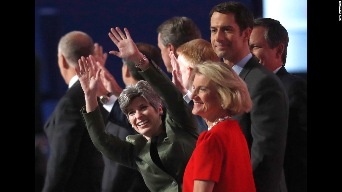 U.S. Sen. Joni Ernst waves as she stands with other first-term senators on Tuesday.