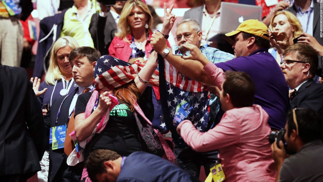 A member of the activist group Code Pink protests inside the arena during Carson&#39;s speech.