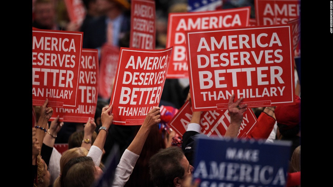 Delegates hold up signs Wednesday.