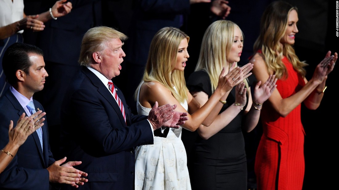 Trump listens to his son&#39;s speech along with other members of his family on Wednesday.