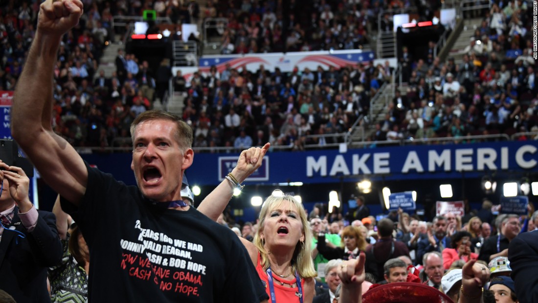 Delegates shout on the floor of the arena on Wednesday.