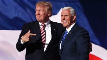 Republican presidential candidate Donald Trump stands with Republican vice presidential candidate Mike Pence and acknowledge the crowd on the third day of the Republican National Convention on July 20, 2016 at the Quicken Loans Arena in Cleveland, Ohio. Republican presidential candidate Donald Trump received the number of votes needed to secure the party's nomination. An estimated 50,000 people are expected in Cleveland, including hundreds of protesters and members of the media. The four-day Republican National Convention kicked off on July 18. 