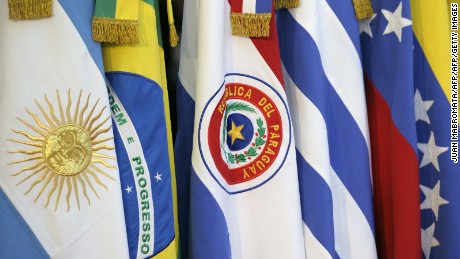 The Paraguayan flag is seen next to other members of the Mercosur during the XLIII Mercosur presidential summit in Mendoza, 1050 Km west of Buenos Aires, Argentina on June 29, 2012. AFP PHOTO / Juan Mabromata        (Photo credit should read JUAN MABROMATA/AFP/GettyImages)