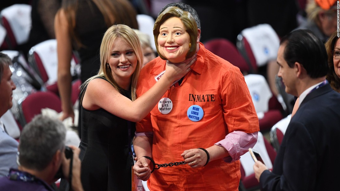 A delegate dressed as Hillary Clinton is accosted by another delegate on Thursday.