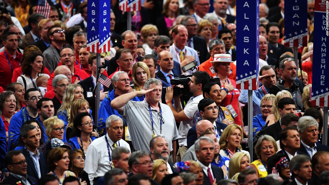 Delegates stand for the national anthem Thursday.