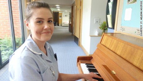 St. Helena Hospice nurse&#39;s assistant Emma Young with the piano from the video. 