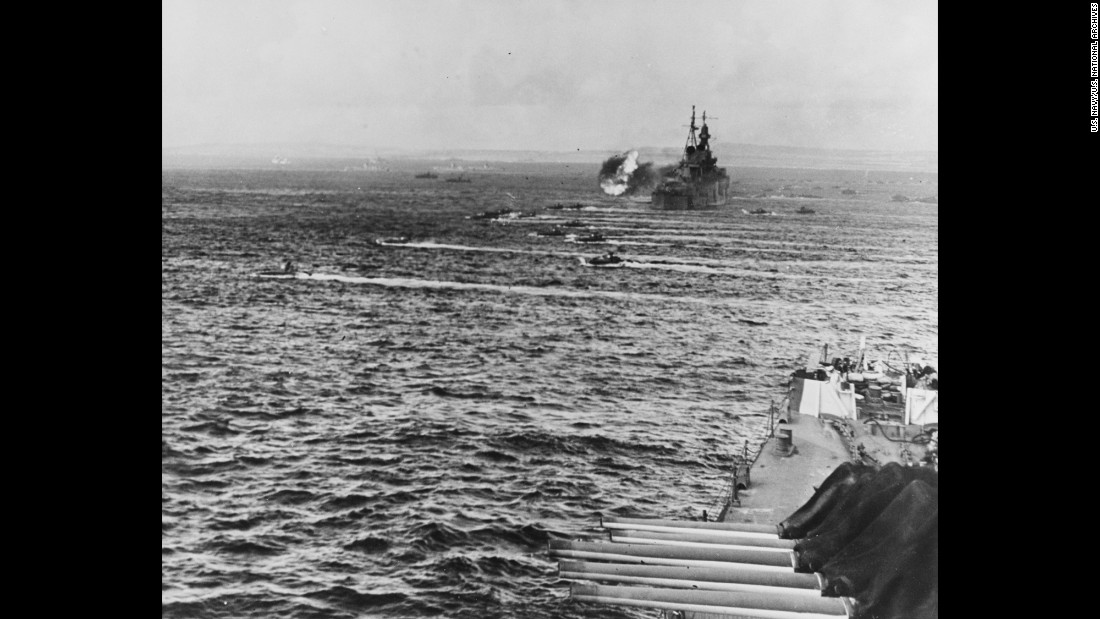 The Indianapolis, in the background, played a major role in operations off Saipan, knocking out Japanese fortifications and weapons. Fifth Fleet commander Adm. Raymond A. Spruance often used the cruiser as his flagship.