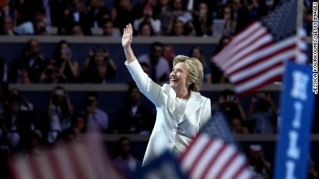 Democratic presidential candidate Hillary Clinton acknowledges the crowd as she arrives on stage during the fourth day of the Democratic National Convention at the Wells Fargo Center, July 28, 2016 in Philadelphia, Pennsylvania. Democratic presidential candidate Hillary Clinton received the number of votes needed to secure the party&#39;s nomination. An estimated 50,000 people are expected in Philadelphia, including hundreds of protesters and members of the media. The four-day Democratic National Convention kicked off July 25.