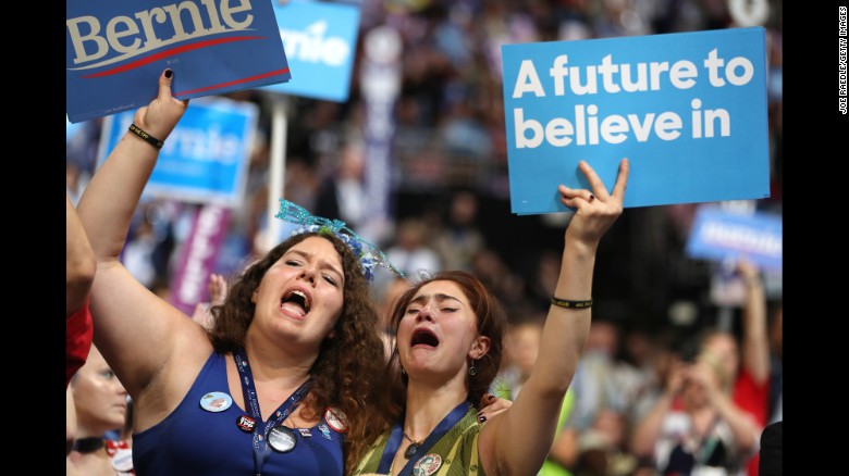Supporters of Sen. Bernie Sanders (I-VT) stand and cheer as he delivers remarks on the first day of the Democratic National Convention at the Wells Fargo Center, July 25, 2016 in Philadelphia, Pennsylvania. An estimated 50,000 people are expected in Philadelphia, including hundreds of protesters and members of the media. The four-day Democratic National Convention kicked off July 25. 