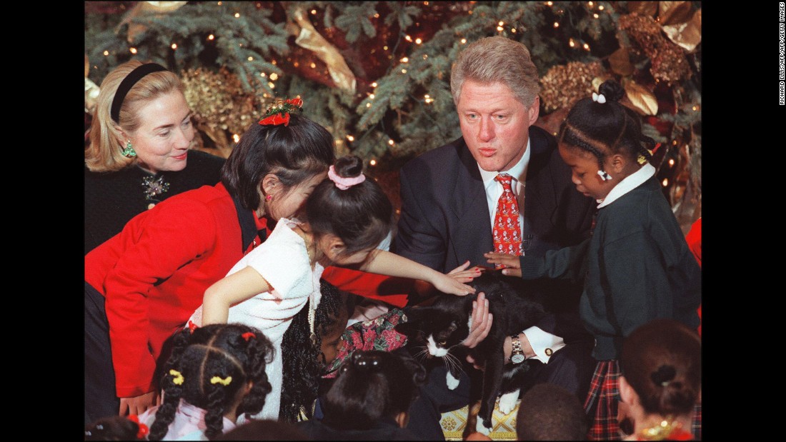 Former President Bill Clinton and First Lady Hillary Clinton, along with Socks, spent time with children during a Christmas gathering at the White House in 1996. &lt;br /&gt;