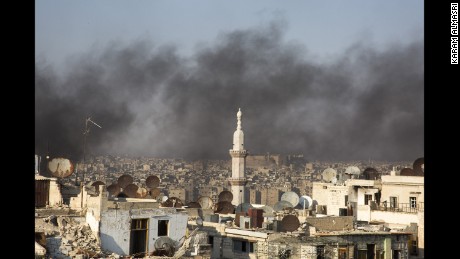 A thick smogs hangs over Aleppo as residents light fires to prevent pilots from bombing their homes.