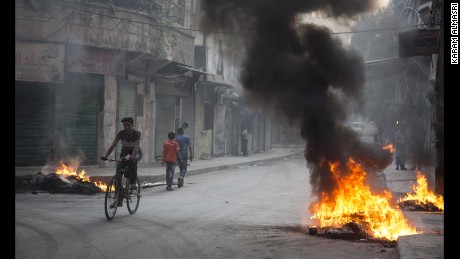 Residents burned tires and other materials to start fires in eastern Aleppo, to obscure the vision of pilots looking to drop bombs on neighborhoods.