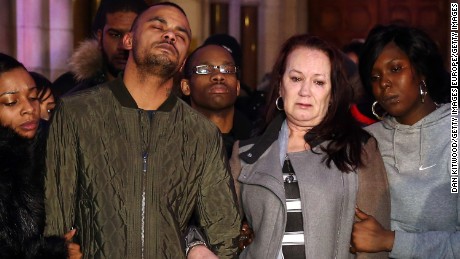 Mark Duggan&#39;s brother Marlon and mother Pam leave the Royal Courts of Justice in London after an inquest found Mark&#39;s death was lawful.
