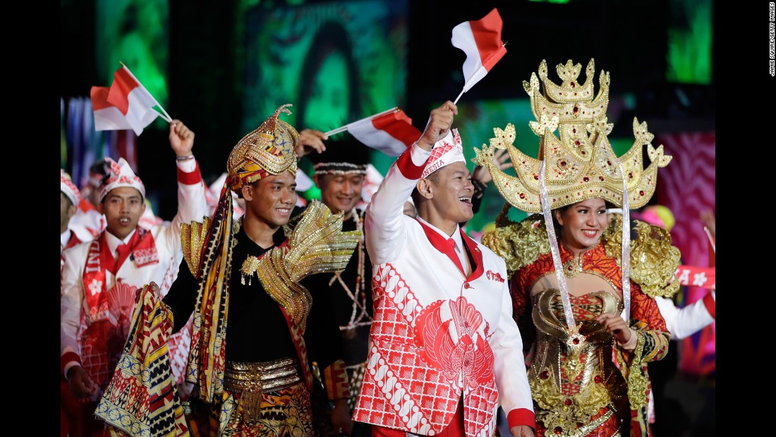 Members of Indonesia&#39;s Olympic team walk during the parade of nations.