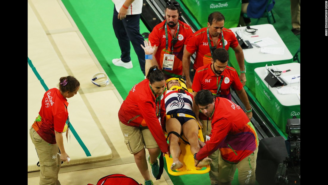 French gymnast Samir Ait Said receives medical attention after breaking his leg while competing on the vault during the artistic gymnastics men&#39;s team qualification round.