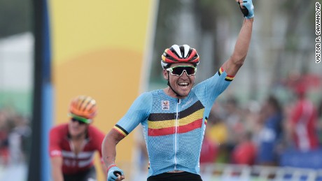 Greg van Avermaet celebrates after crossing the finish line to win the men&#39;s cycling road race. 