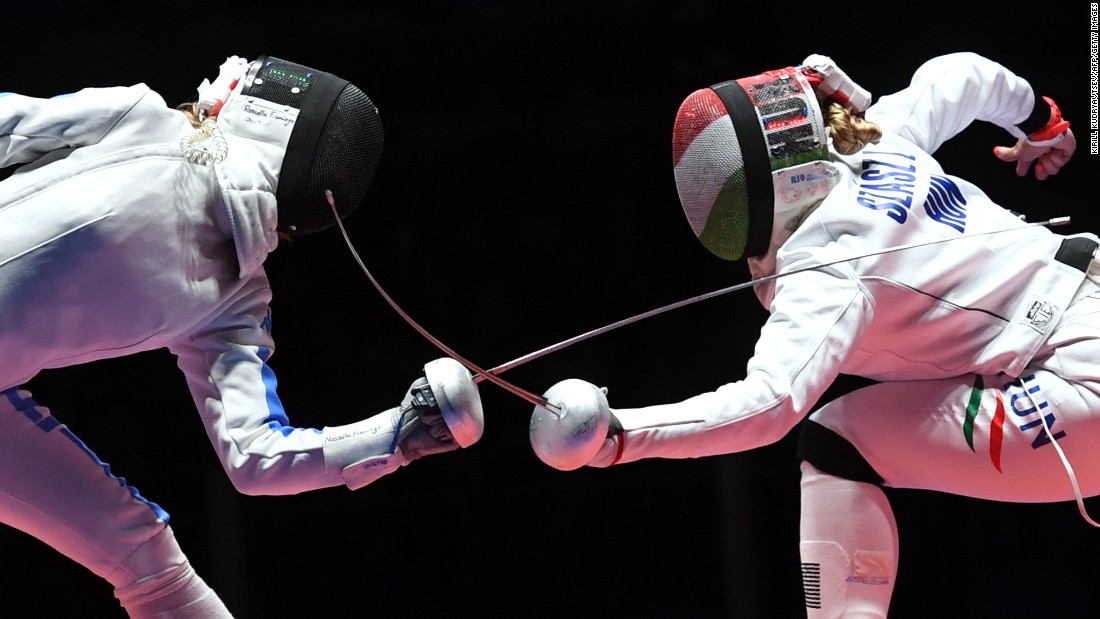 Italy&#39;s Rossella Fiamingo competes against Hungary&#39;s Emese Szasz during the women&#39;s individual epee gold medal bout in fencing. Szasz won the gold medal. 