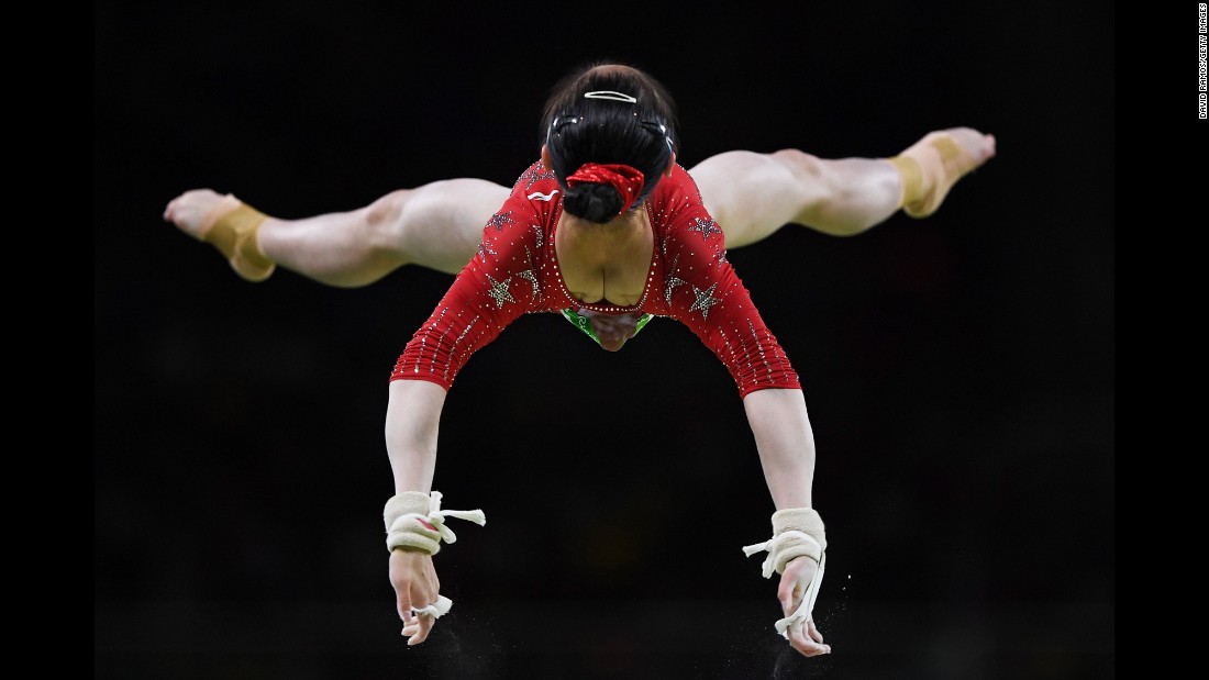 Jiaxin Tan of China competes on the uneven bars during the women&#39;s qualification for Artistic Gymnastics.