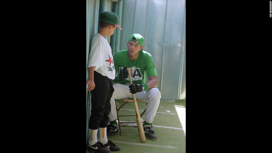 Rodriguez, shown here as a teenager in 1993, talks with 11-year-old John Santos Griffith during practice for the U.S. Olympic Festival Competition in San Antonio, Texas.