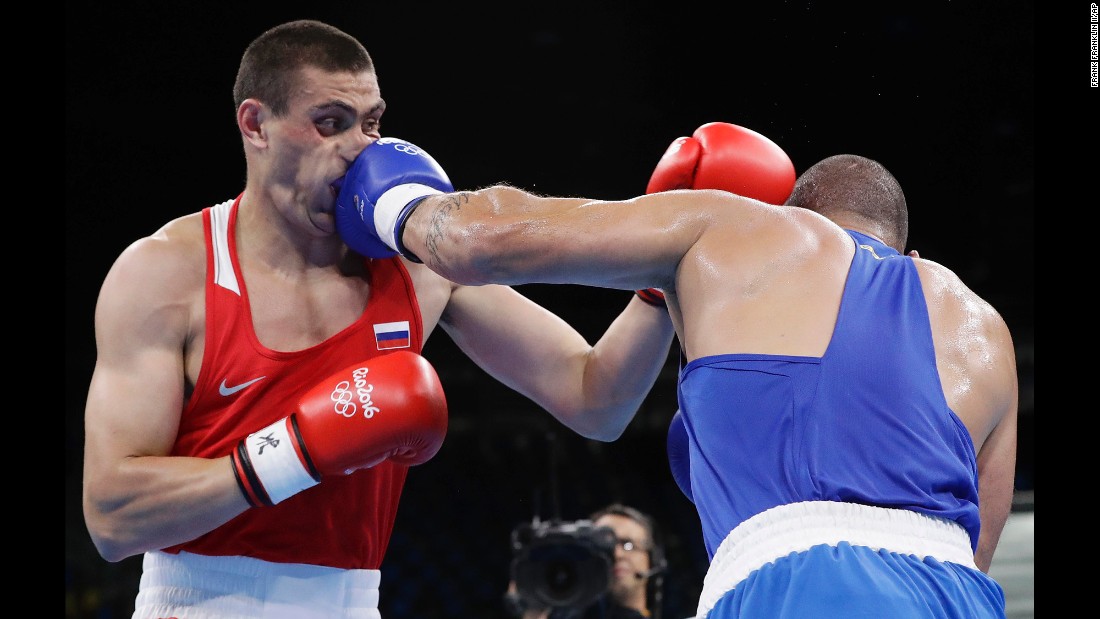 Brazil&#39;s Juan Nogueira, right, lost to Russia&#39;s Evgeniy Tishchenko in their heavyweight boxing match.