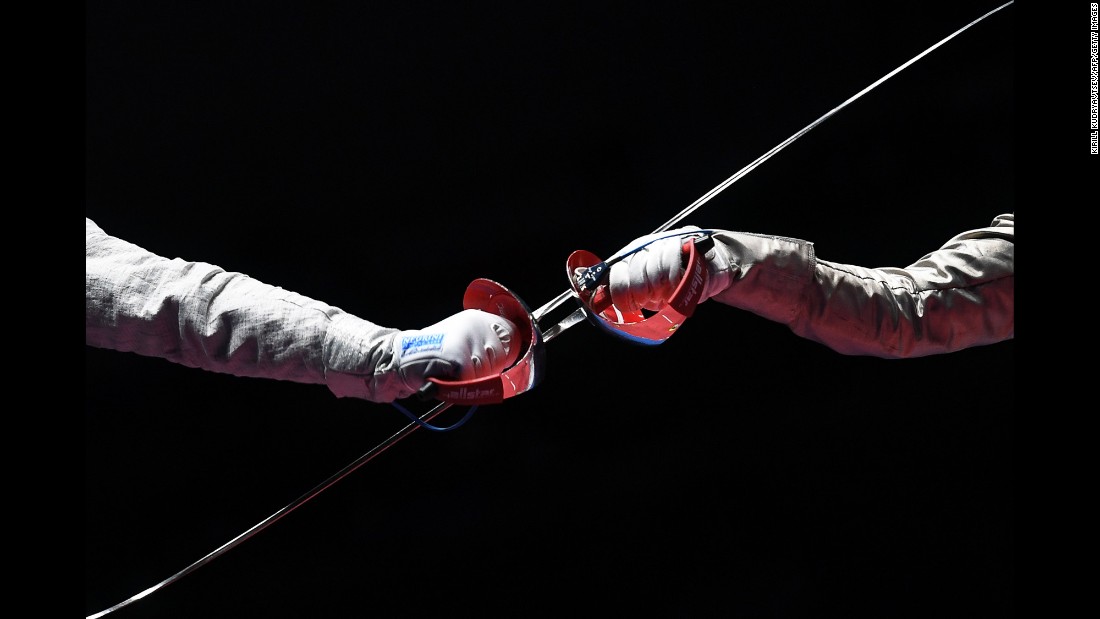 Russian fencer Sofya Velikaya, left, competes against France&#39;s Manon Brunet during a sabre semifinal bout. Velikaya defeated Brunet but lost in the final to her Russian compatriot Yana Egorian.