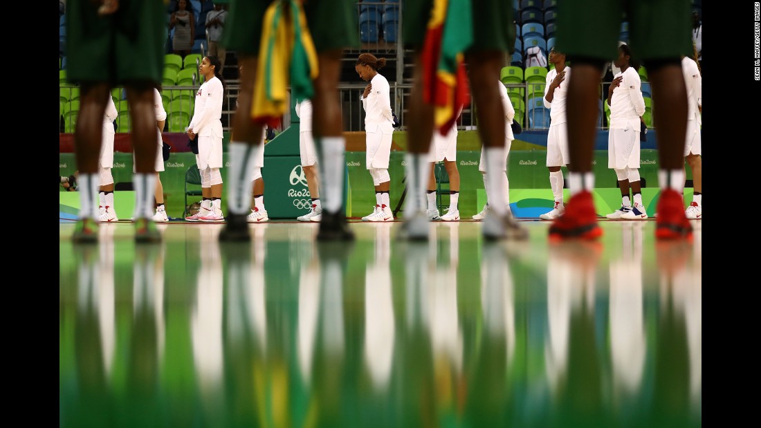 The women&#39;s basketball teams from Senegal and the United States line up before their preliminary round game on Sunday, August 7. The United States won 121-56, breaking their record for most points scored in the Olympics.