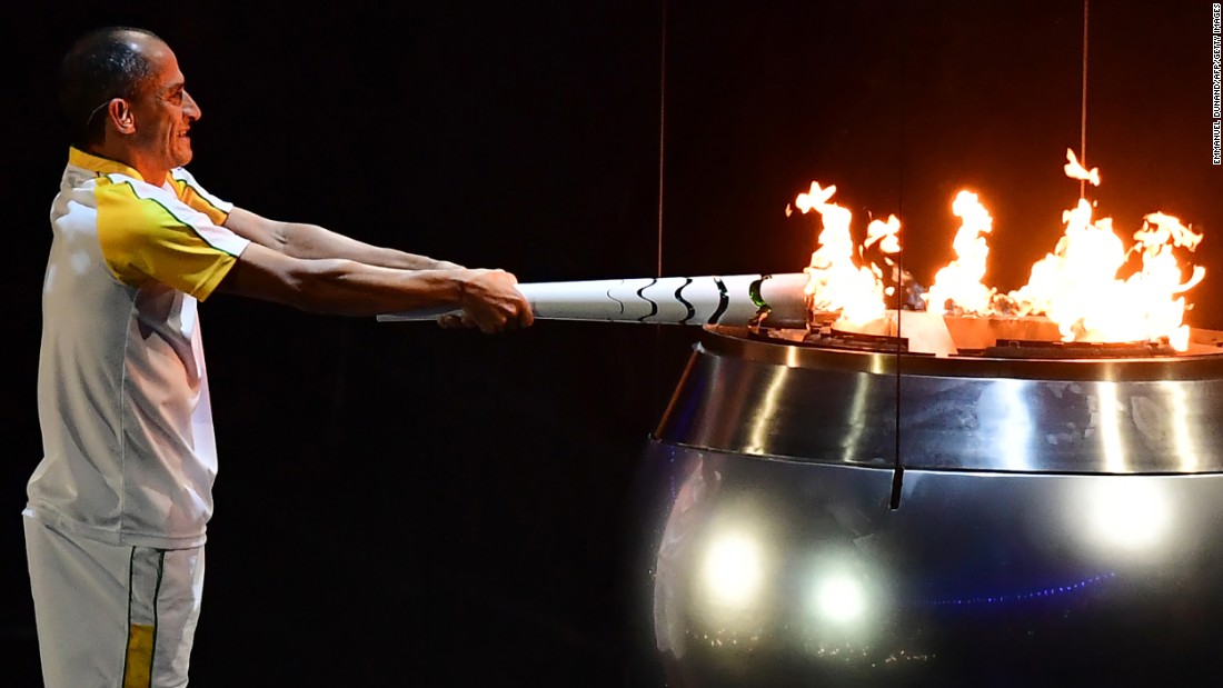 Vanderlei Cordeiro de Lima, a former Brazilian long-distance runner, lights the Olympic cauldron during &lt;a href=&quot;http://www.cnn.com/2016/08/05/sport/gallery/olympics-opening-ceremony/index.html&quot; target=&quot;_blank&quot;&gt;the opening ceremony&lt;/a&gt; in Rio de Janeiro on Friday, August 5. De Lima was leading the Olympic marathon in 2004 when he was attacked by a protester near the end of the race. He ended up finishing third, but the graceful way he handled the disappointment won him plaudits around the world for his sportsmanship.