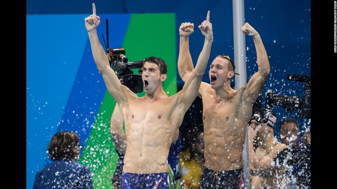 U.S. swimmers Michael Phelps, left, and Caeleb Dressel celebrate after their relay team won gold in the 4x100 freestyle on Sunday, August 7. It was the 19th gold medal for Phelps, the most decorated Olympian of all time.