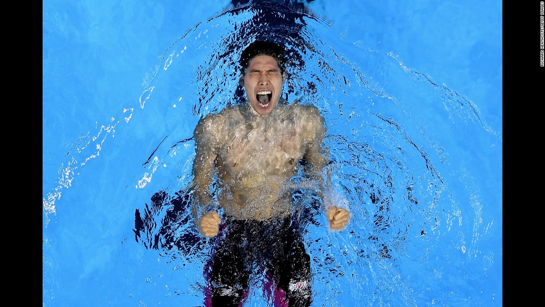 Japanese swimmer Kosuke Hagino celebrates in the pool after winning the 400-meter individual medley on Saturday, August 6.